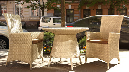 Cafe with tables and chairs in an old street in Europe with retro vintage Instagram style filter effect
