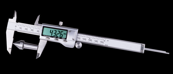 Measurement of conical steel part of machine by digital caliper. Accurate gauging a replaceable center in lathe tailstock by metallic measuring device with green display. Isolated on black background.