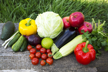 Collection of fresh organic fruits and vegetables on wooden table. Top view.