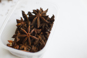 box of star anise on white background