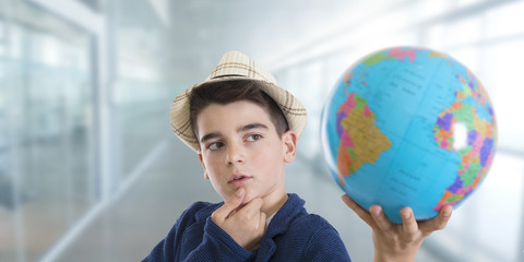 thoughtful and creative student with the world map