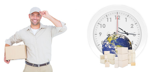 Portrait of happy delivery man with cardboard box wearing cap against logistics graphic