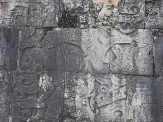 Block of ancient mayan stony relief with pictograph at ruins of Chichen atza city in Mexico