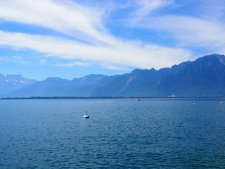 Panorama of alpine Lake Geneva with buoyes landscape seen from promenade in european Montreux city in Switzerland