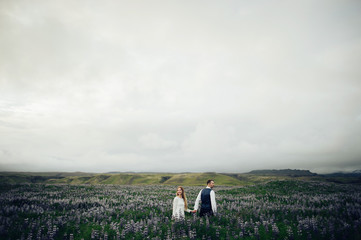 Amazing romantic view of happy couple near beautiful grand water