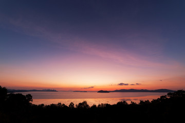 Beautiful scenery nature of light sunrise or sunset over tropical sea in phuket thailand.