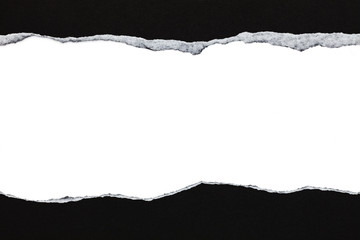 Black ripped paper and white background with space for text.