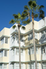 Typical pastel-colorfed 1930s Art Deco architecture with palm trees in Miami, Florida