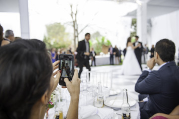 woman recording the bridal dance from her cell phone