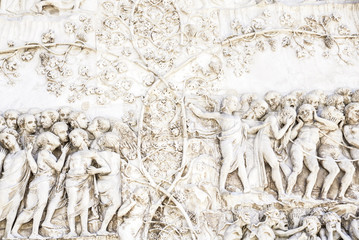 Detail of the facade of the Duomo of Orvieto, Italy. Marble bas-relief representing episodes of the...