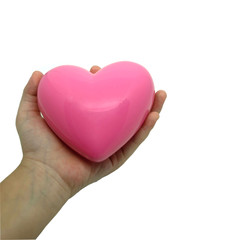 Pink heart In kids little girl hand White background