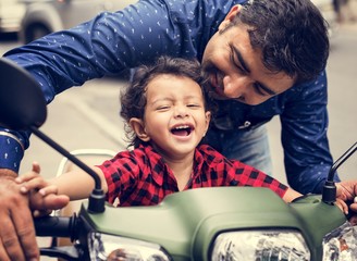 Young Indian boy riding the motobike