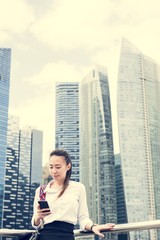 Fototapeta na wymiar Asian businesswoman in a city