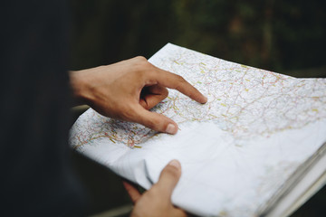 Caucasian man looking at a map travel and explore concept