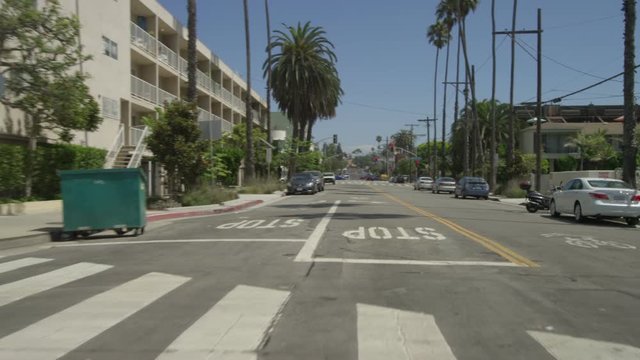 Rear view of a Driving Plate: Car traveling on Bicknell Avenue turns onto Ocean Avenue and transitions onto Barnard Way, continuing to Neilson Way in Santa Monica, California.