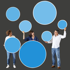Diverse people holding colorful blank circles