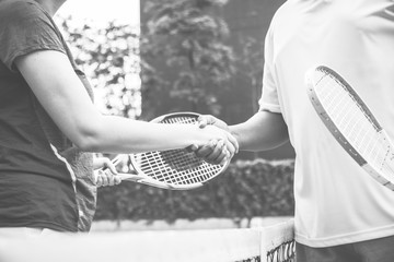 Players shaking hands after a tennis match