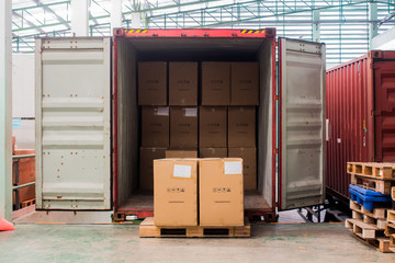 The cartons with loading out of container - obrazy, fototapety, plakaty