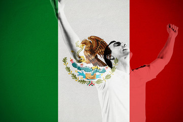 Excited football fan cheering against mexico national flag