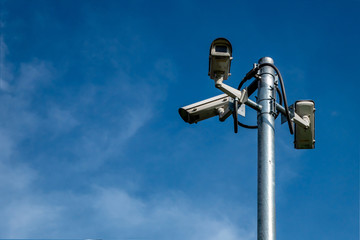 CCTV or VDO camera for traffic at the outside of building with the blue sky in the sunny day.