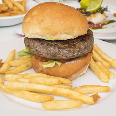 Closeup of a Hamburger and French Fries