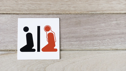 man and woman Islamic prayer sign on wood wall with space for adding text