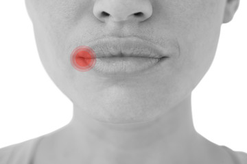 Woman with luscious lips against highlighted pain