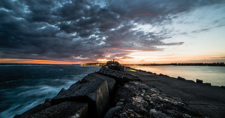 Stormy skys building over the Newcastle brake wall - Australia