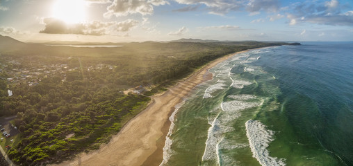 Aerial landscape of ocean coastline at sunset in Australia
