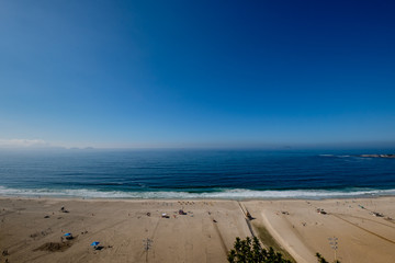 view of Copacabana beach during early morning, taken from the rooftop of a hotel, some slight fog...