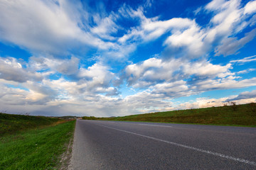 speed highway through the field. asphalt-paved road