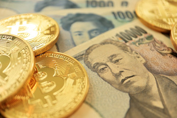 Bitcoin on Japanese Yen Bills. Concept for Cryptocurrencies in Japan