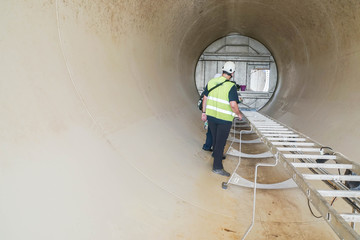 service engineer on critical items of wind turbine tower inspection © jummie