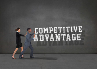 Obraz premium Composite image of business team standing and pushing against buzz words in room