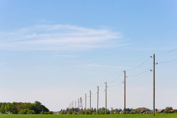 telegraph pole on blue sky horizon
