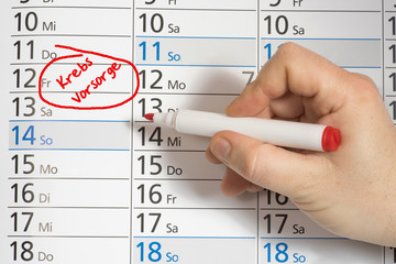 Ein Kalender und ein Termin zu einer Krebsvorsorge Untersuchung