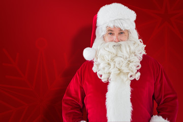 Naklejka premium Portrait of smiling santa claus against red snowflake background