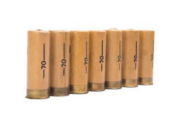 seven bullets for a gun in a row, on a white background