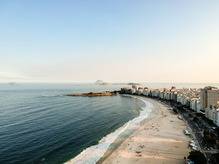 aerial drone view of Copacabana beachs during late afternoon,, some shadows can be seen on the sand. Rio de Janeiro, Brazil