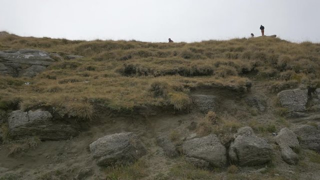Rocks covered with dried grass in Bucegi Mountains