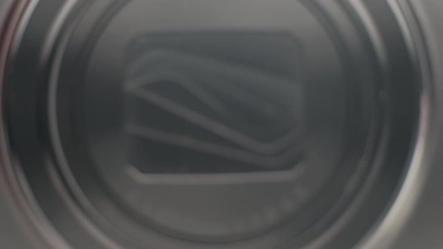 Close up of a compact camera lens opening