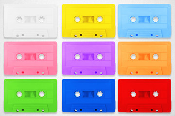 Collection of retro cassette colorful tapes places on white background.