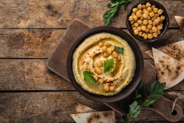 healthy homemade chickpea hummus with olive oil and smoked paprika, - obrazy, fototapety, plakaty