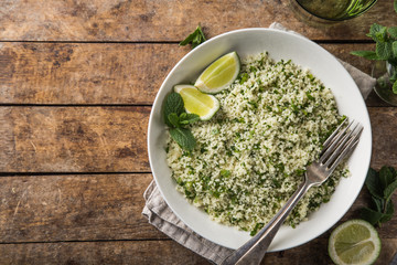 couscous with lemon and herbs in white bowl