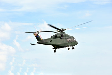 Fototapeta na wymiar Helicopter on blue sky.