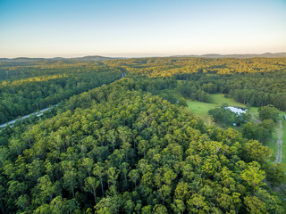 Fototapeta premium Aerial view of native Australian forests and Pacific Highway in New South Wales, Australia