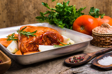 Raw pork knuckle in marinade