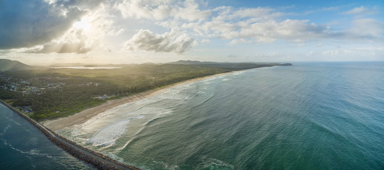 Aerial panorama of North Haven Beach and Camden Haven Inlet at sunset. NSW, Australia
