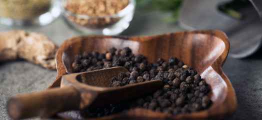 A collection of fresh spices on a gray stone table