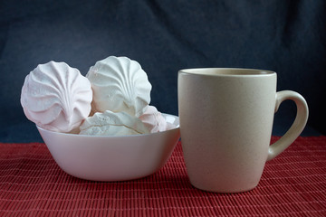 White zephyr marshmallow on porcelain plate